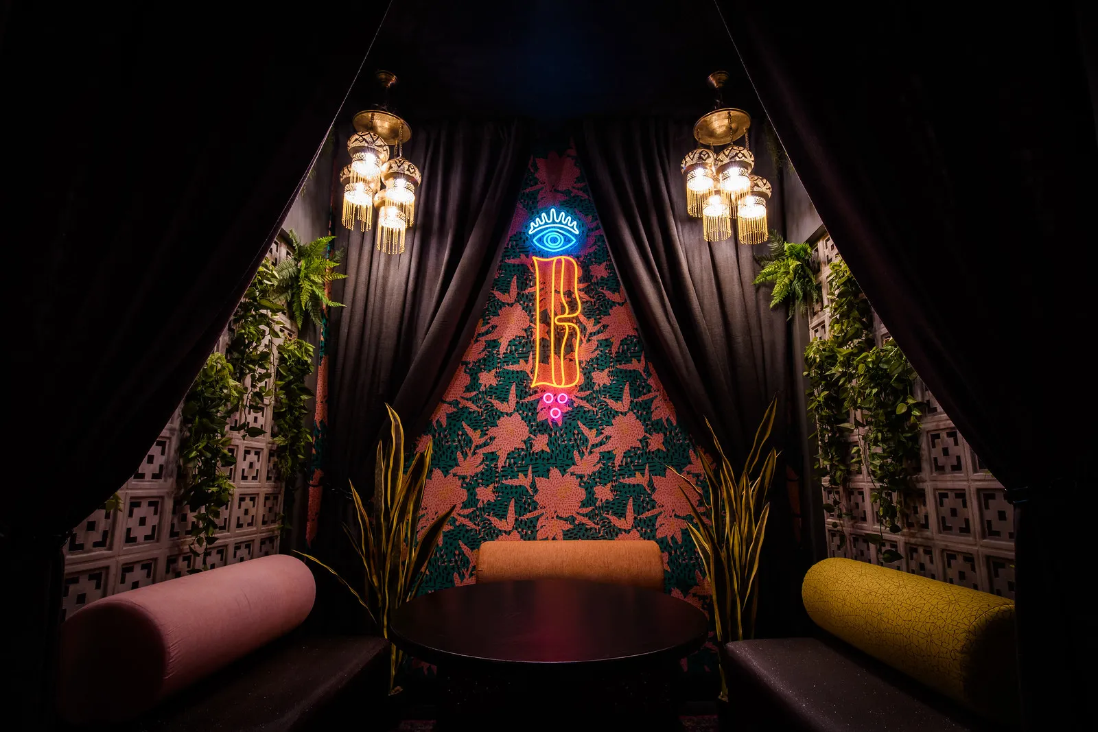 The curtained cabana under the neon B