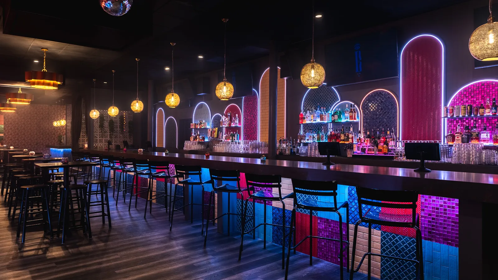 The Bazaar main bar with neon arches and lantern light