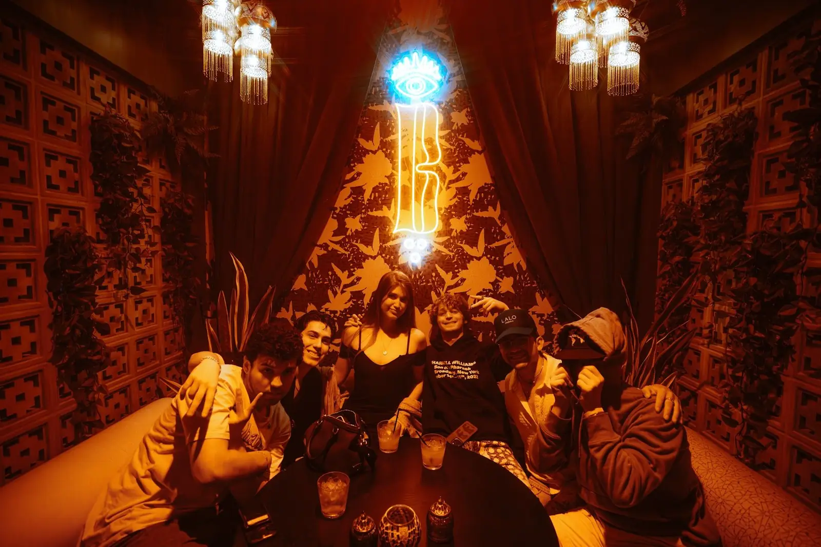 A crew in one of the cabanas under the neon B