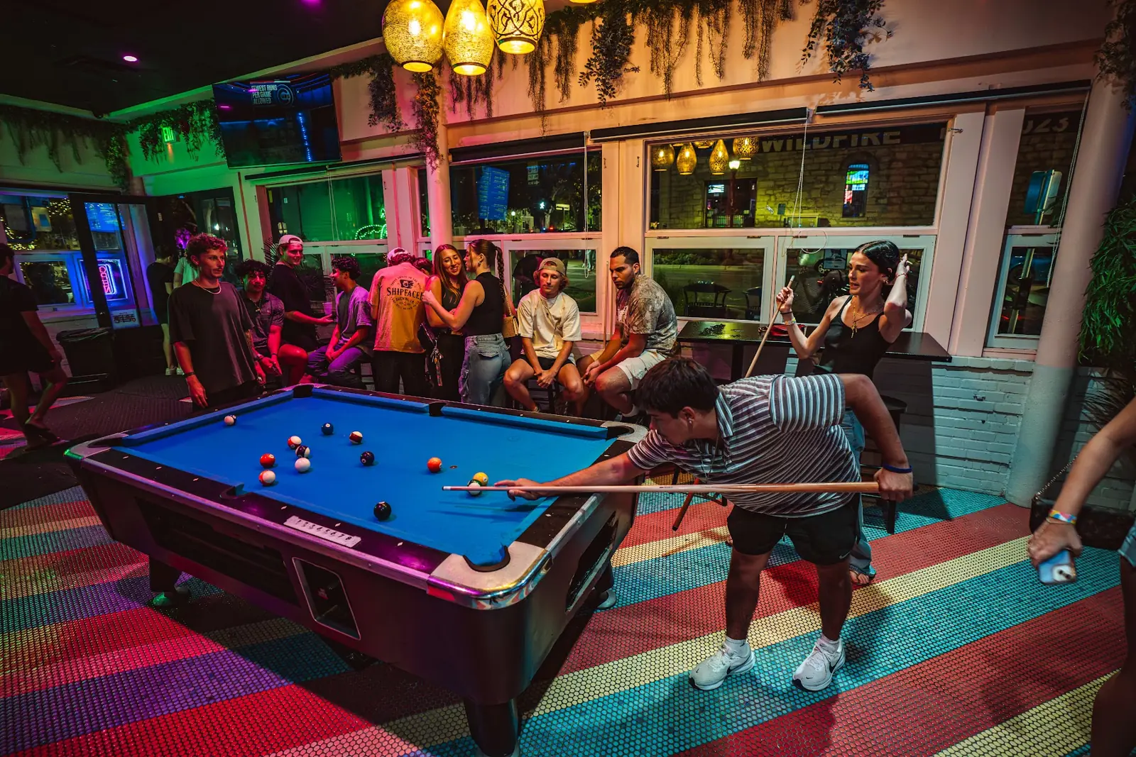 A game of pool in the Jungle Room by the front windows