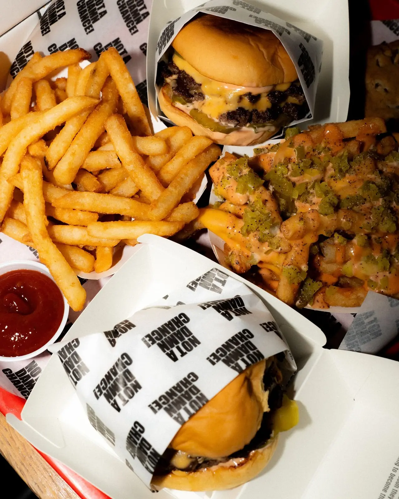 Stacked NADC cheeseburgers and fries